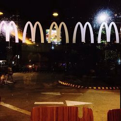 Illuminated fountain at night