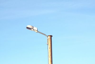 Low angle view of street light against clear blue sky