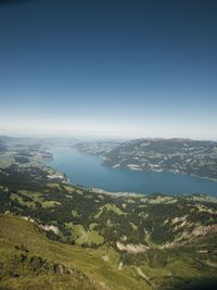 Scenic view of landscape against clear blue sky