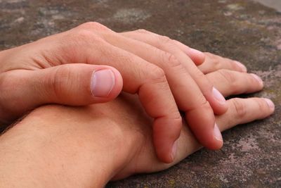 Close-up of person stacking hands