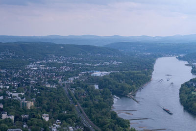 High angle view of buildings and mountains against sky