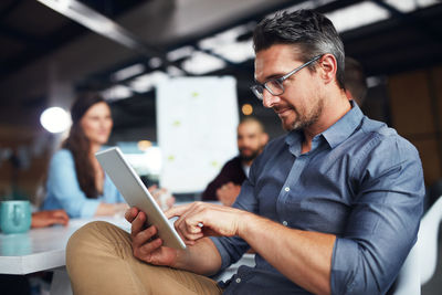 Businessman using tablet pc at office