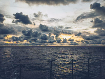 Scenic view of sea against sky at sunset