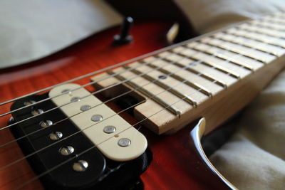 Close-up of guitar on table