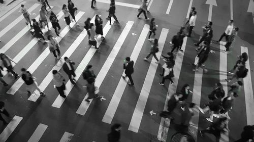 High angle view of people crossing road