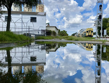 Reflection of building on puddle