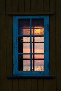 Reflection of sunset on window