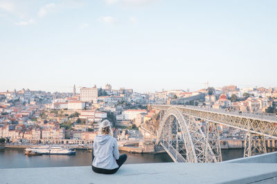 Rear view of woman looking at cityscape