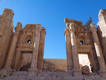 Low angle view of old ruins against clear sky