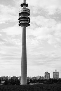 Low angle view of tower against cloudy sky