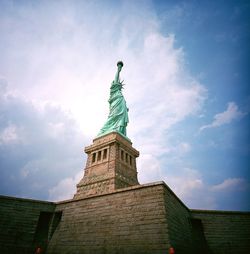 Low angle view of statue against cloudy sky