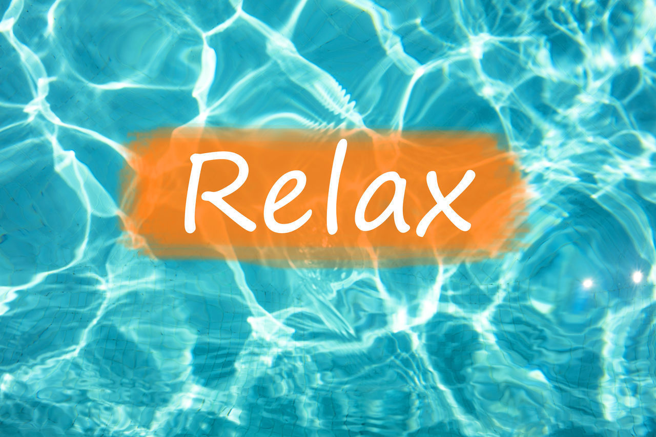 HIGH ANGLE VIEW OF TEXT ON POOL