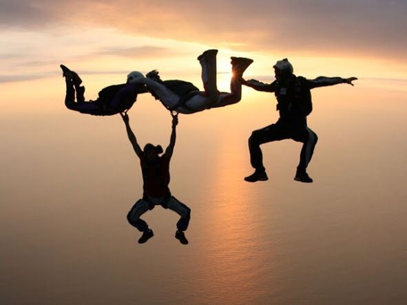 sunset, full length, lifestyles, leisure activity, mid-air, fun, jumping, orange color, enjoyment, sky, silhouette, arms raised, arms outstretched, carefree, standing, balance, freedom, sport