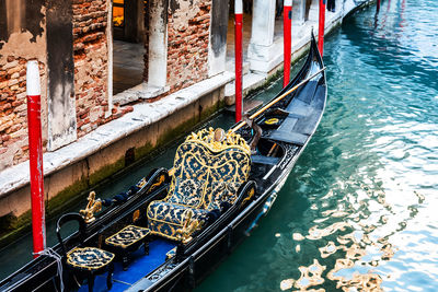 High angle view of gondola moored in canal