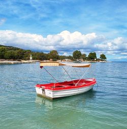 A small boat sways on the waves of the ionian sea .albanian riviera. paradise. best vacation.