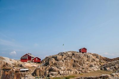 Low angle view of mountain against blue sky