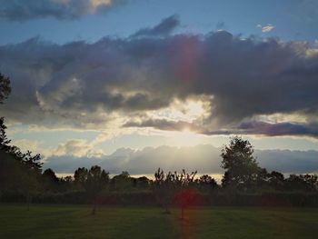 Scenic view of field against sky during sunset