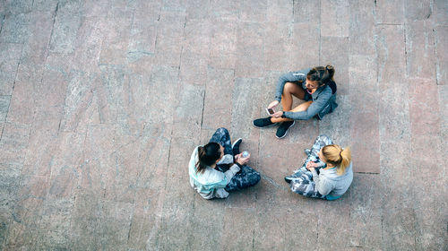 High angle view of woman sitting on beach