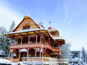 Low angle view of building against sky during winter