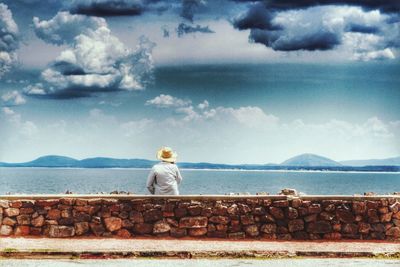 Scenic view of sea against cloudy sky