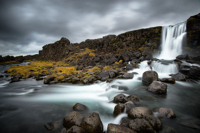 Öxarárfoss is a popular waterfall as its base is filled with black rocks