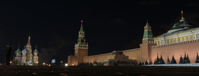 Illuminated buildings in city at night