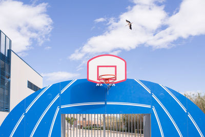 Low angle view of basketball court against sky