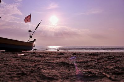 Scenic view of beach against sky during sunset