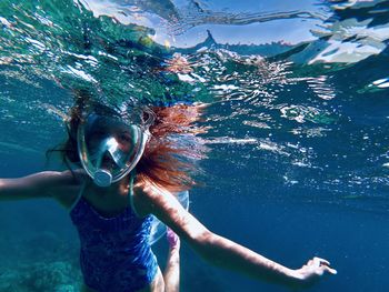 Woman swimming in sea