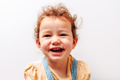 Portrait of happy girl against white background