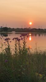 Scenic view of lake against sky during sunset