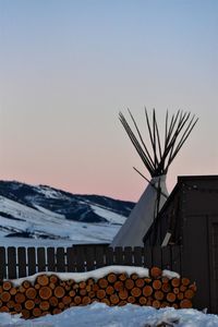 Stack of roof against sky during sunset