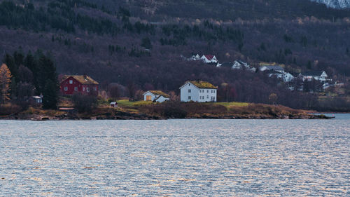 Houses on the fjord shore near tromso in norway