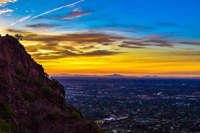 Scenic view of landscape against sky during sunset