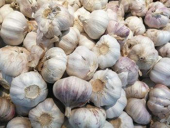 Full frame shot of garlic for sale in market stall