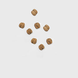 High angle view of candies against white background