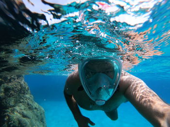 Man swimming in sea