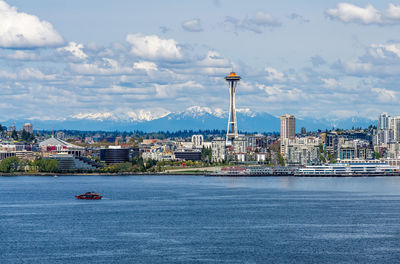 Cascade mountain can be seen behind the seattle skyline in washington state.