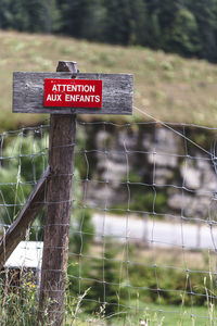 Warning sign on fence