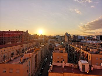 High angle view of buildings against sky during sunset