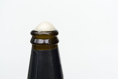Close-up of bottle against white background