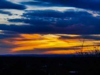 Scenic view of dramatic sky during sunset