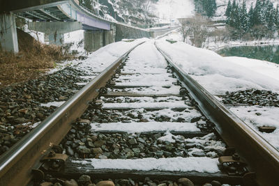 Snow covered railroad tracks in winter