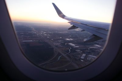 Aerial view of cityscape seen through airplane window