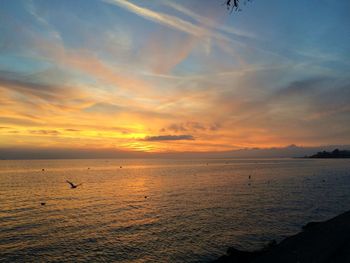 Scenic view of sea against sky at sunset