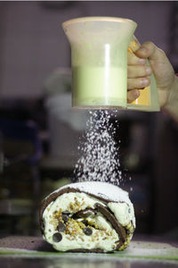 Close-up of hand holding ice cream