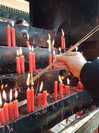 Illuminated candles in temple