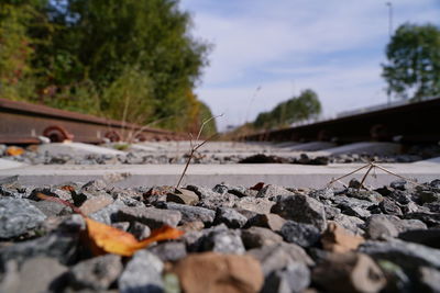 Close-up of railroad track against sky