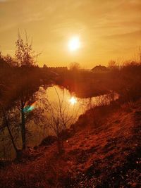 Scenic view of sunset over lake