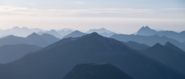 Scenic view of mountains against cloudy sky